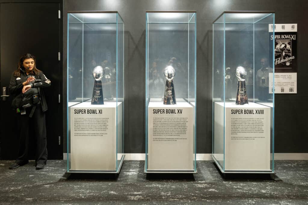 Display cases of the Las Vegas Raiders 3 super bowl trophies 